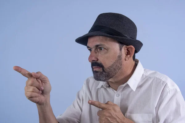 stock image portrait of elderly man pointing forward with fingers