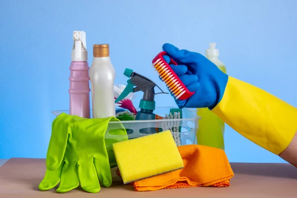 stock image basket with cleaning products for home hygiene use with plastic packaging