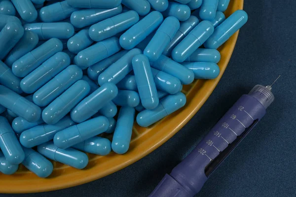 Yellow Plate Filled Blue Medicine Capsules Representing Drug Overdose Associated — Stock Photo, Image