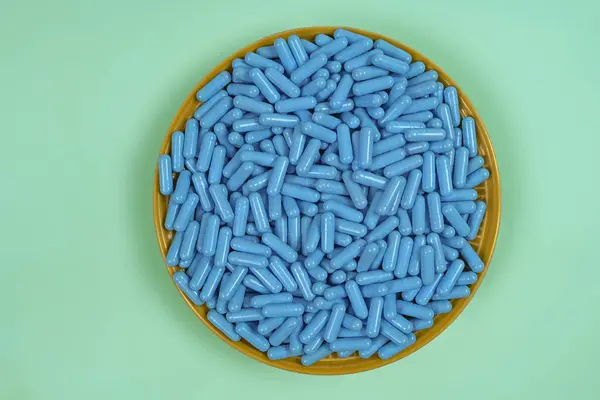 Yellow Plate Full Blue Medicine Capsules Representing Drug Overdose Top — Stock Photo, Image