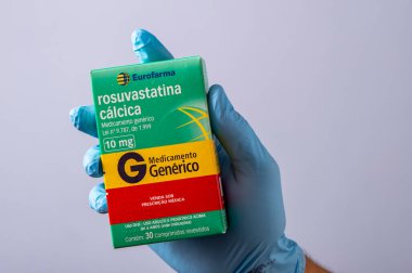 Rio, Brazil - January 27, 2023, hand with protective rubber glove holding medicine box, rosuvastatin calcium