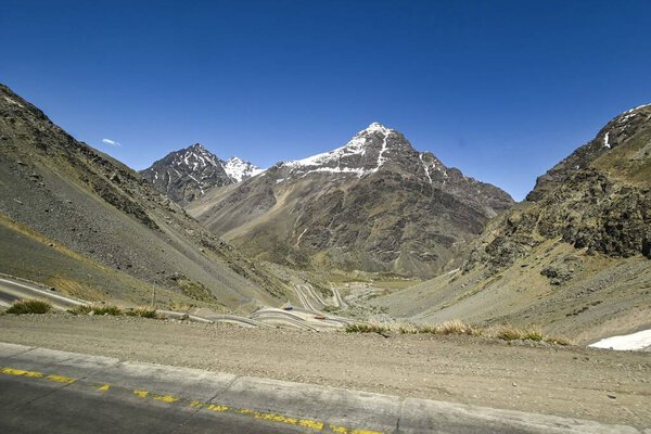 View of mountains in the Andes mountain range near Portillo in summer with little snow