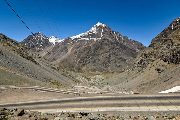 stock image Los Caracoles desert highway, with many curves, in the Andes mountains. Way to Portillo