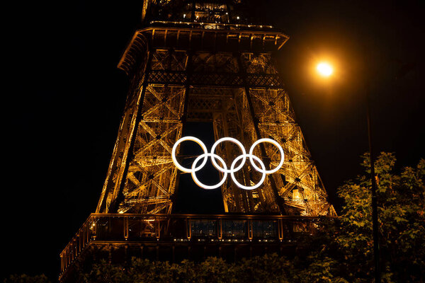 Paris, France, june 07 2024 - Eiffel Tower with Olympic rings to mark the games taking place in the city by night