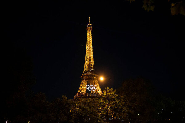 Paris, France, june 07 2024 - Eiffel Tower with Olympic rings to mark the games taking place in the city by night
