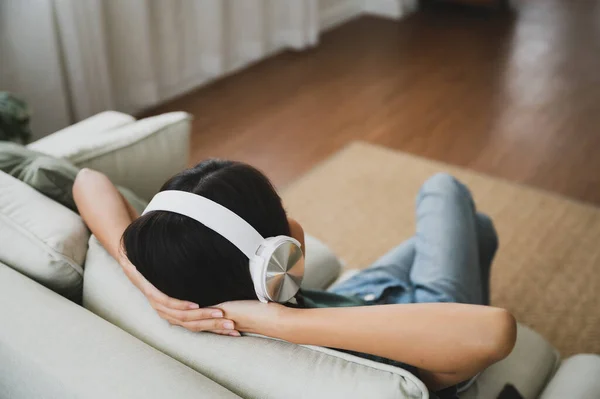 Young Asian Woman Listening Music Couch Living Room Home Happy — Stockfoto