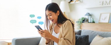 Young asian woman using mobile smartphone. Chatting conversation in chat box icons pop up bubble speech. Social media direct message