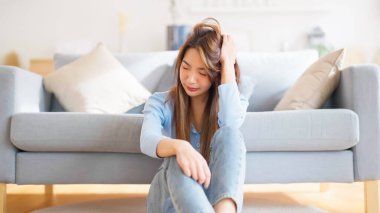 Young asian woman upset , sadness and frustrated by problem with work or relationships. Feeling despair and anxiety, loneliness, having psychological trouble