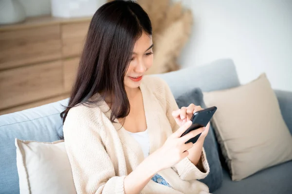 Happy Young Asian Woman Relax Comfortable Couch Home Texting Messaging — Photo