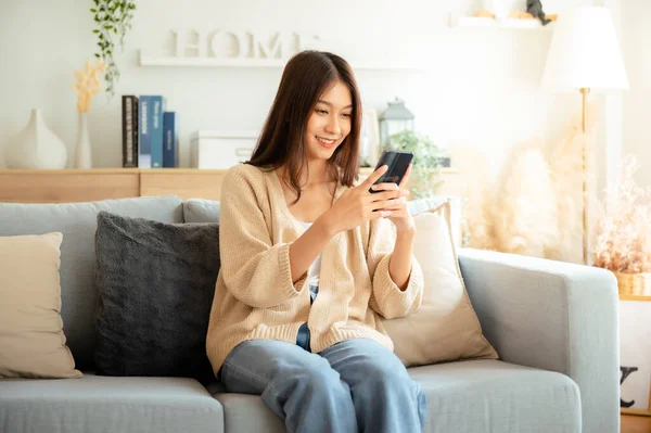 Happy Young Asian Woman Relax Comfortable Couch Home Texting Messaging — Photo