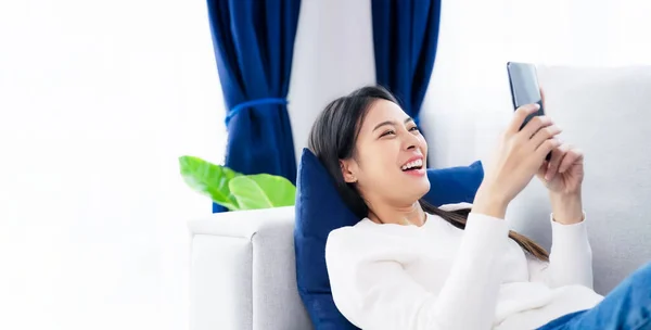 Happy Young Asian Woman Relaxing Home Female Smile Lying Sofa — Stockfoto