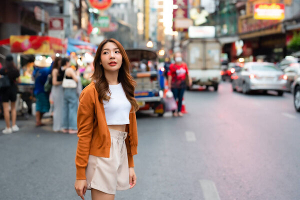 Young asian woman traveller. Beauty traveller female in city lifestyle chinatown street food market Bangkok, Thailand
