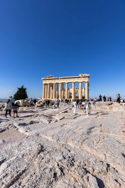 stock image Athens, Greece - October 17, 2022: Group of tourists in front of Parthenon on Acropolis of Athens. Temple was dedicated to the goddess Athena