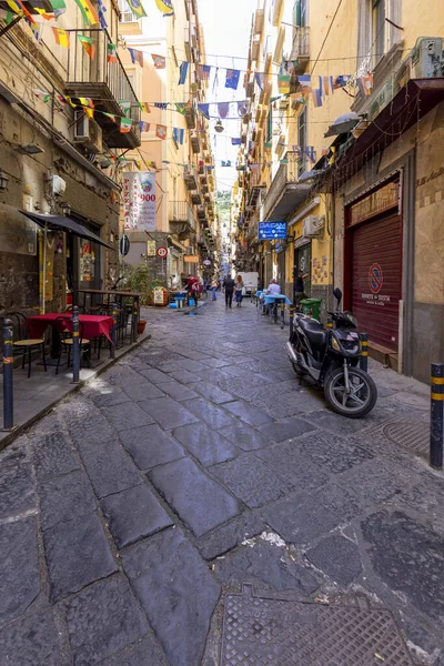 stock image Naples, Italy - June 27, 2021: A typical Italian cityscape, colorful buildings, narrow street