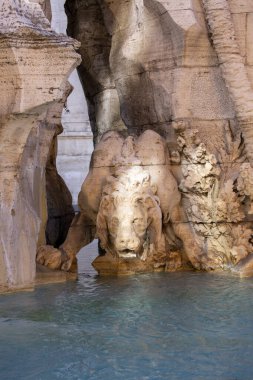 Sculpture of lion at 17th century Fountain of the Four Rivers (Nile, Danube, Ganges, Rio de la Plata ) located in Piazza Navona, Rome, Italy