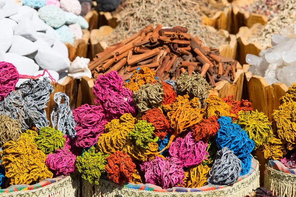Colored dried marine algae from Red Sea, seaweed shaped into decorative balls on street market in Egypt