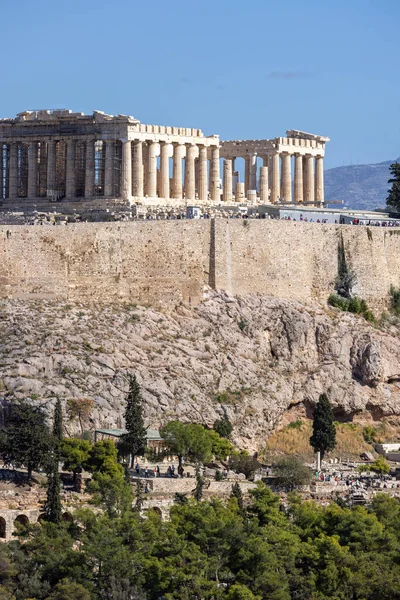 stock image Athens, Greece - October 17, 2022: View of the Acropolis of Athens with Parthenon on a background of blue sky from Muse Hill. Temple was dedicated to the goddess Athena