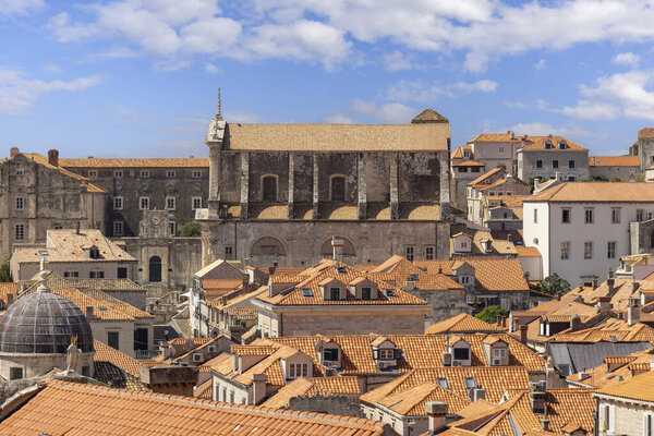 Dubrovnik, Croatia - June 27, 2023: Aerial view of Old Town (Stari Grad) from medieval City Walls by Adriatic Sea. Church of St. Ignatius in a dinstance