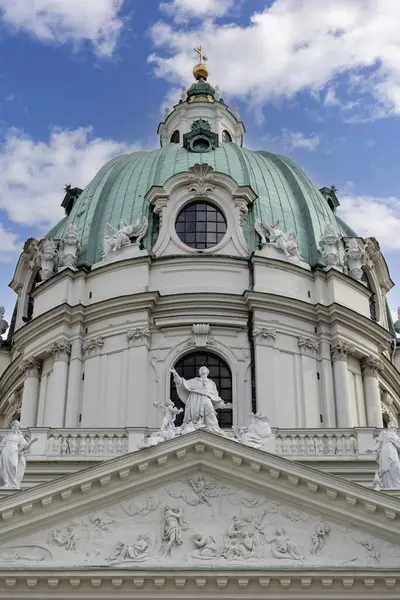 stock image Vienna, Austria - April 25, 2024: Dome of baroque Church of St. Charles (Karlskirche) located on Charles Square (Karlsplatz), decorative pediment