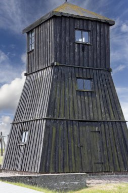 Majdanek; Lublin; Poland - May 24, 2022: Majdanek concentration and extermination camp ( Konzentrationslager Lublin), wooden guard tower and barbed wire fence. It was a Nazi camp built by the SS clipart