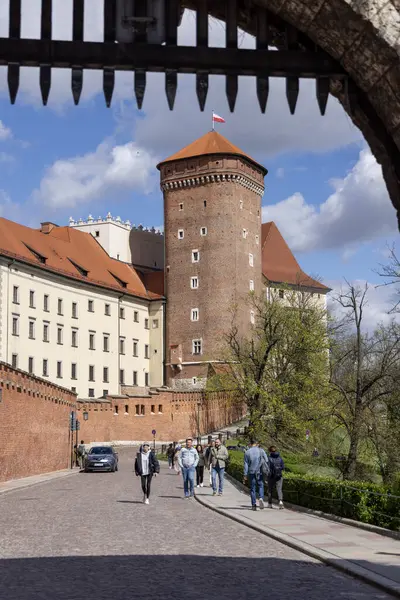 stock image Krakow, Poland - April 3, 2024 : Wawel Castle with Senators Tower, seat of Polish kings. View through the Bernardine Gate