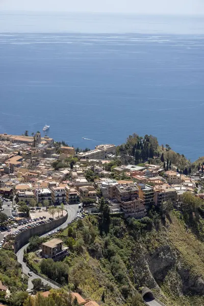 stock image Taormina, Castelmola, Sicily, Italy - April 28, 2023: Aerial view of city Taormina on the bay of the Ionian Sea from observation point of path of Saracens