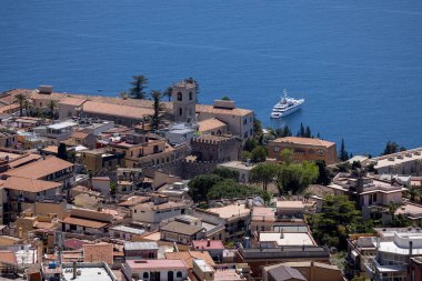 Taormina, Castelmola, Sicily, Italy - April 28, 2023: Aerial view of city Taormina on the bay of the Ionian Sea from observation point of path of Saracens clipart