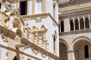 Bari, Italy, Apulia - May 23, 2024: Decorative facade of medieval Roman Catholic Archdiocese of Bari-Bitonto. Building is located next to Bari Cathedral clipart