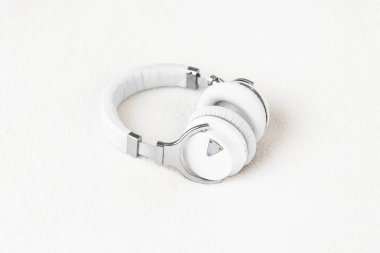 Headphones big noise cancellation white on soft fluffy clean background