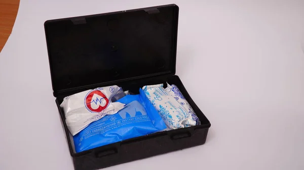 close-up of a first aid kit box on a white background.