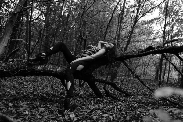 stock image black-white photo of a warrior girl in the forest