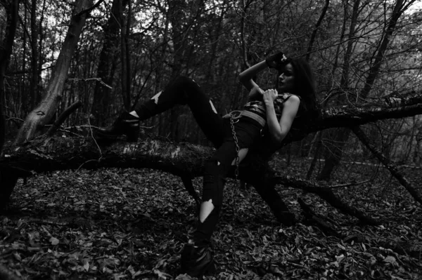 stock image black-white photo of a warrior girl in the forest