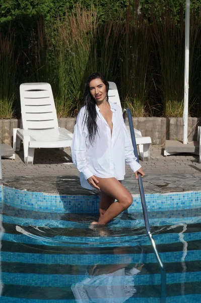 stock image sexy girl in lingerie and a white shirt in a swimming pool  