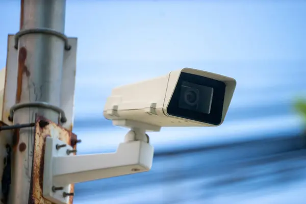 A stock photo of a CCTV (Closed Circuit Television) typically features an image or illustration related to surveillance, security, or monitoring systems. This type of image could include