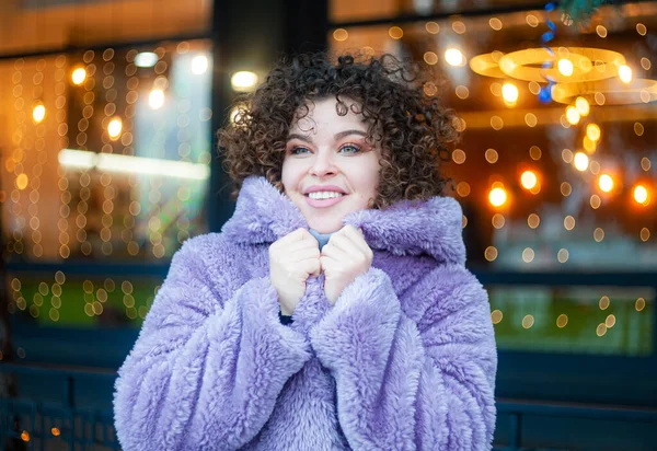 Curly Haired Woman Trendy Violet Coat Posing Festive Christmas Background — Stock Photo, Image