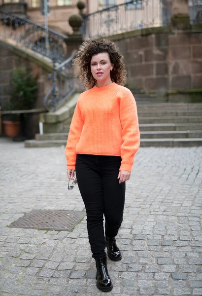 Stylish Young Woman Curly Hair Orange Sweater Walking City — Stock Photo, Image