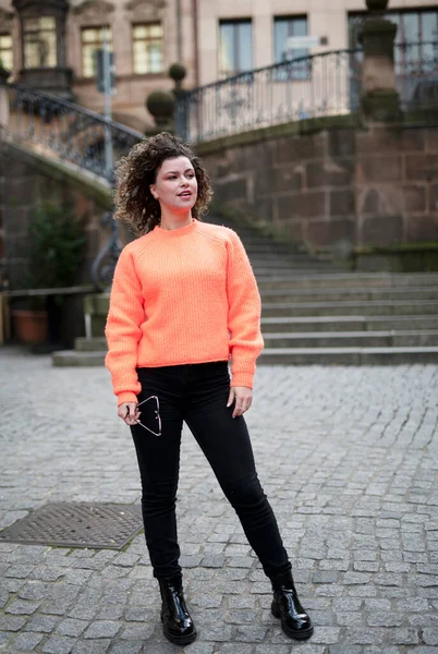 Fashionable Young Woman Curly Hair Orange Sweater Dark Sunglasses Walking — Stock Photo, Image