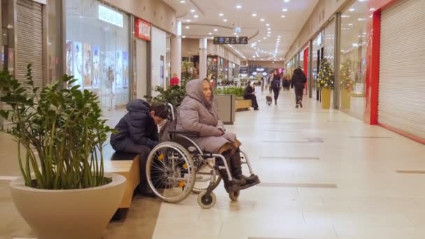 Poland Gdansk Elderly Woman Sits Wheelchair Mall Christmas — Stock Video