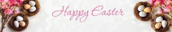 easter banner. Happy easter eggs on nest. happy easter card. The inscription on the banner Happy Easter. copy space