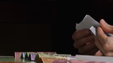 Board game. Guy holding cards
