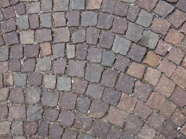 Road background formed by porphyry cobblestones