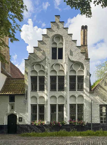 stock image Brugge, Flanders, Belgium - June 22, 2024: Ten Wijngaerde Beguinage management and welcome center building, front facade