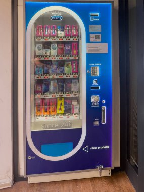 Trieste, Italy - June 28, 2024: Condom and other Durex products vending machine closeup in Via Saverio Mercadante clipart