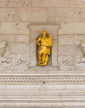 Kotor, Montenegro - July 2, 2024: Old historic downtown. The golden statue of Saint Tryphon, who is the patron saint of the city, above the main entrance door to his cathedral clipart