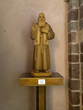 Kotor, Montenegro - July 2, 2024: Old historic downtown. Saint Tryphon Cathedral wooden statue of older man asking for charity donations clipart