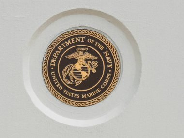 Ventura, California, USA - September 20, 2025: Ventura County Government Center. Veterans Memorial. Marines Gold-Brown Seal closeup on white background