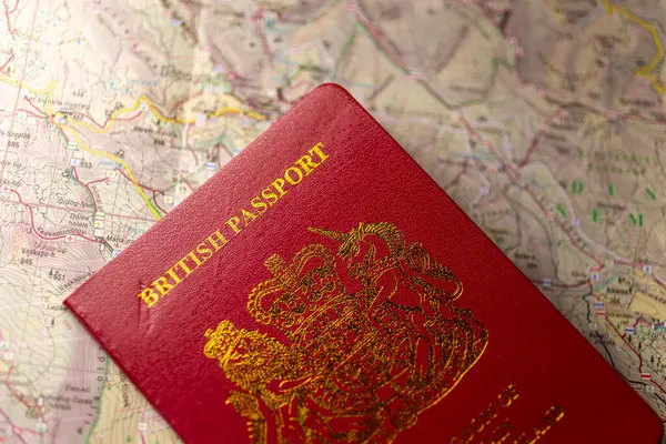 British passport on an old paper map.