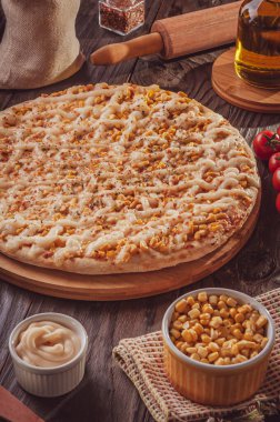 Brazilian pizza with tomato sauce, mozzarella, corn, catupiry and oregano (Pizza de milho especial)