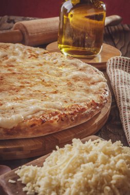 Brazilian pizza with mozzarella, catupiry and oregano (Pizza de catupiry) - Closeup.
