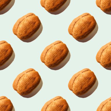 Mavi pastel yumuşak renk arkaplanlı ekmek. Kusursuz desen. Ekmek